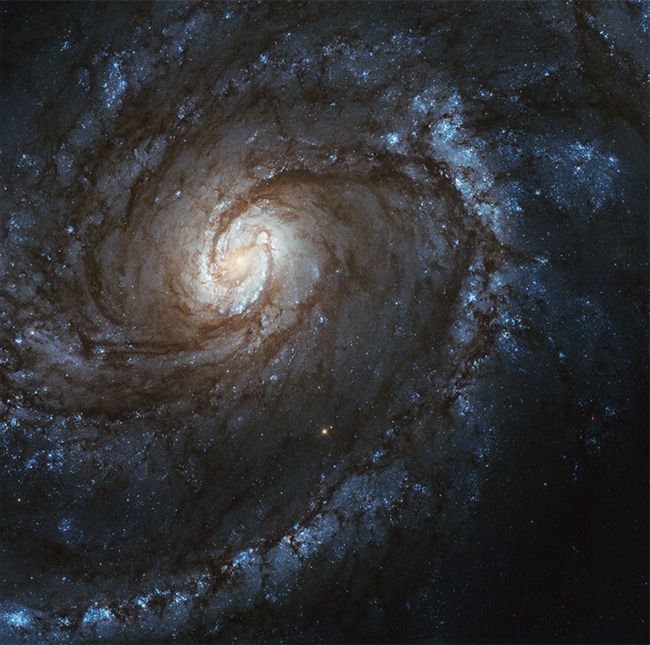 Image of M-100 spiral galaxy acquired by the Hubble Space Telescope.